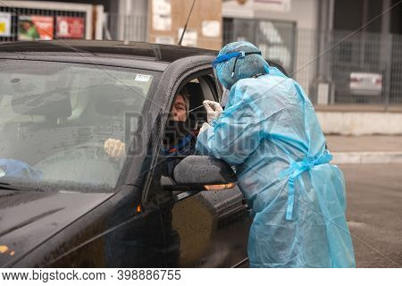 A Medical Worker Wearing Special Suit To Protect Against Coronavirus, Conduct A 