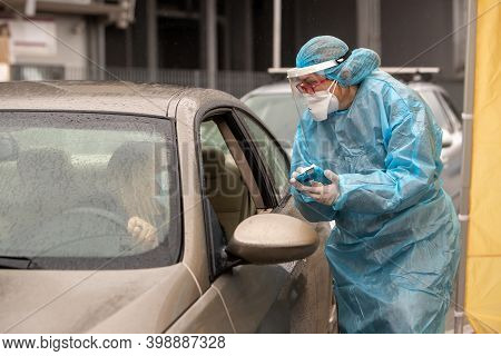 A Medical Worker Wearing Special Suit To Protect Against Coronavirus, Conduct A 