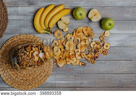 Apple Fruit Chips In The Jar With Fresh Fruits On The Wooden Table. Chips For Fruit Leather. Healthy