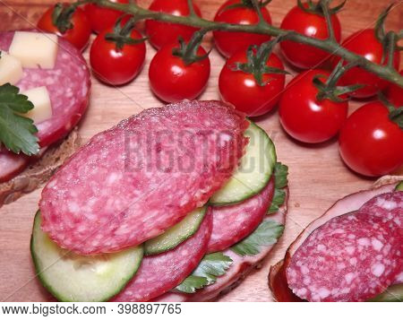Sandwich With Different Types Of Sausage And Vegetables, Quick Snack. High Quality Photo