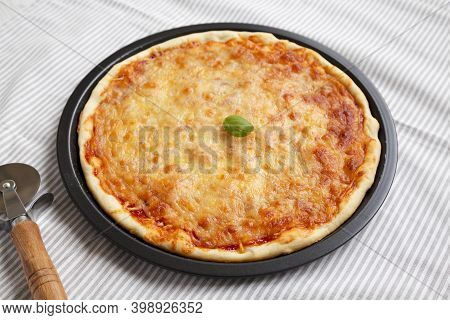 Homemade Neopolitan Pizza With Cheese And Basil, Low Angle View.