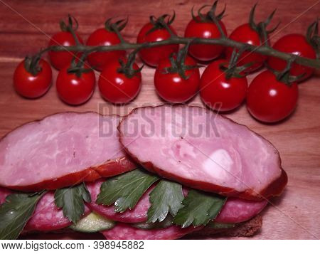 Sandwich With Different Types Of Sausage And Vegetables, Quick Snack. High Quality Photo