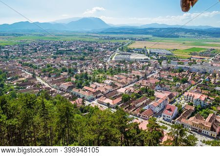 Panoramic View From The Top Of Rasnov Citadel, Cetatea Rasnov, On The City And Romanian Carpathians 
