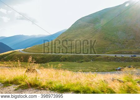 Romanian Carpathian Mountains On A Summer Sunny Day With A Lot Of Clouds. Amaizing View The Transfag