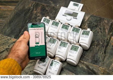 Paris, France - Oct 25, 2020: Pov Male Hand Holding Latest Iphone 12 Pro With Multiple Vr50 Thermost