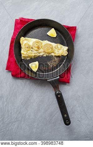 Fried Baked Mackerel Trachurus With Onions And Dried Herbs In An Old Frying Pan. Country Style. Top 
