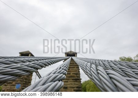 Heavy Steel Wire Cable Leading To Stone Pier On Historic Bridge Stone And Streel Suspension Structur