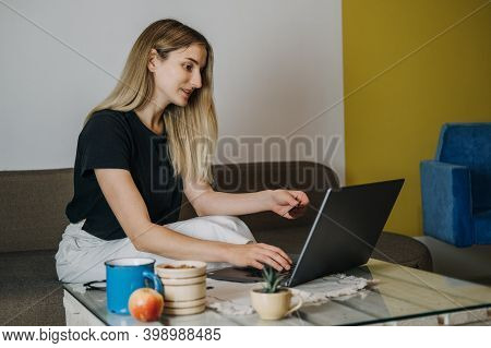 Shopping Online, Savvy Shoppers, Installment Payments. Woman At Home Using Credit Card And Laptop Fo