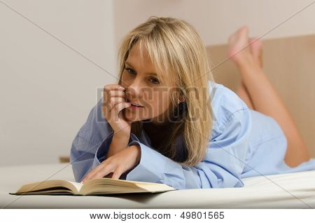 young beautiful woman reading book