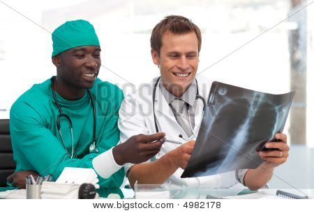 Doctor And Surgeon Looking At An Xray