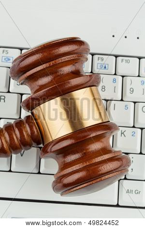 gavel on computer keyboard, symbolic photo for e-commerce and consumer protection