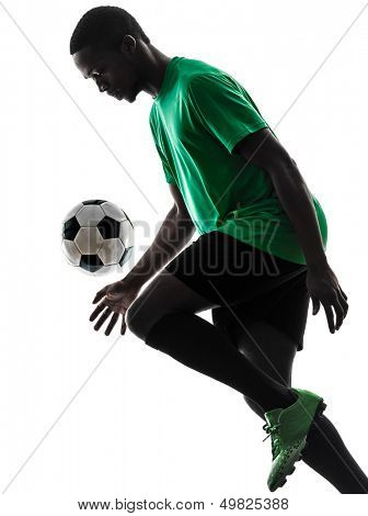 one african man soccer player green jersey juggling in silhouette  on white background