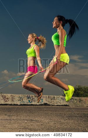 Summer vacation - women with skipping rope 