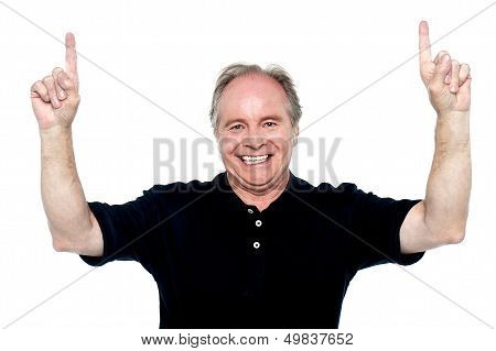 Cool And Confident Old Man Indicating Upwards