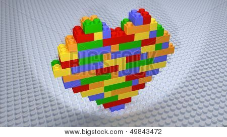 Colourful Heart Bricks Constructed On White Base