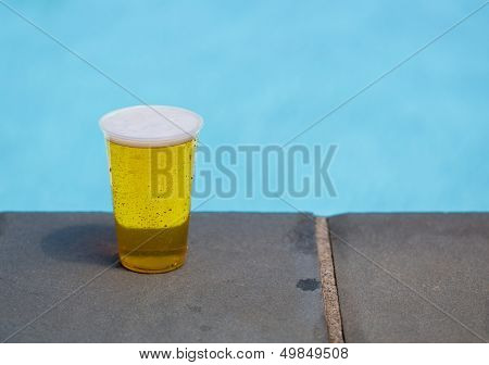 Golden Lager Or Beer In Disposable Plastic Cup