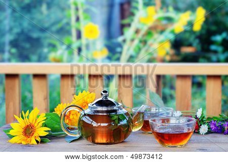 Herbal Tea In Teapot And Cup.