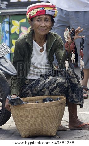 Bali, Indonesia-june 24Th: An Old Woman Selling Monkey Trinkets In Ubud On 24Th June 2012. Bali's Ol