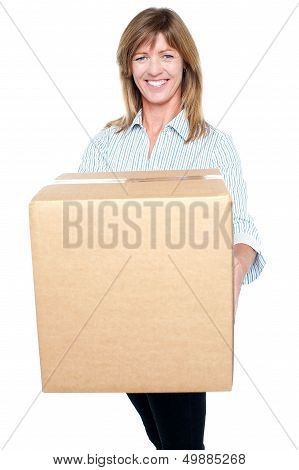 Attractive Executive Posing With A Packed Carton