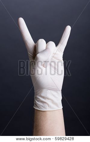 Male hand in latex glove - metal sign