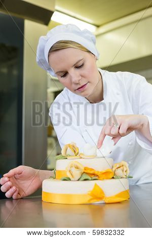 Confectioner, Baker Or Pastry Cook Preparing Cake