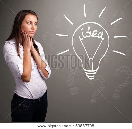 Pretty young girl comming up with a light bubl idea sign