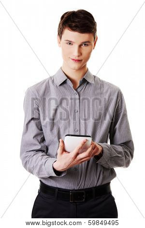 Young businessman using tablet computer isolated on white background