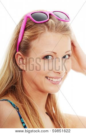 Young summer girl with pink sunglasess, isolated on white
