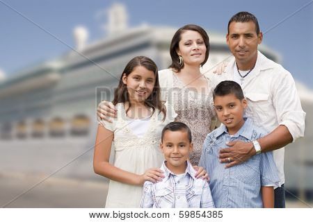 Young Happy Hispanic Family On The Dock In Front of a Cruise Ship.