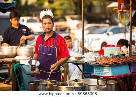 AYUTTHAYA, THAILAND - MAR 11: An unidentified street seller near Ayutthaya Historical Park on Mar 11, 2012 in Ayutthaya, Thailand. 