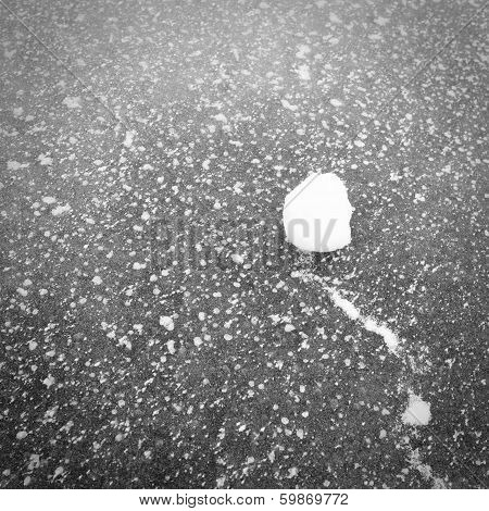 Fragment of a frozen lake.Snow on ice.