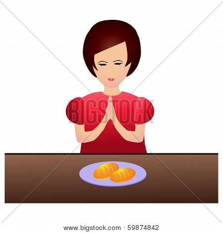 Woman praying during dinner