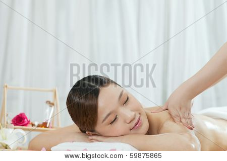 .a Young Woman Enjoying Massage.