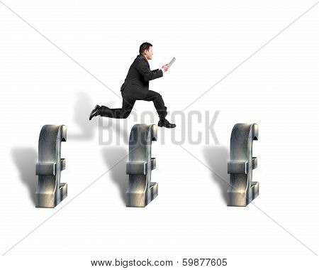 Businessman Jumping Over 3D Pound Symbols