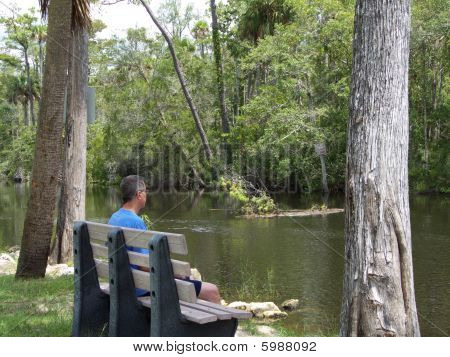 Man On River Bench