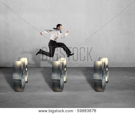 Businessman Jumping Over Usd Symbols