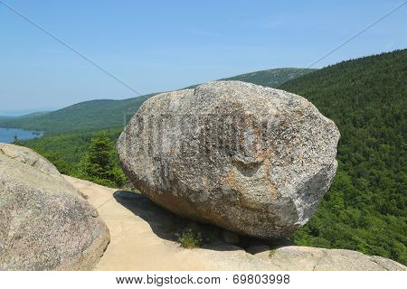 Bubble Rock on top of the South Bubble Mountain and Jordan Pond at Acadia National Park, Maine