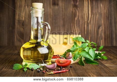 Olive Oil With Cheese, Basil And Spices On A Wooden