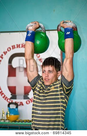 Young Man At Competitions On Weight Lifting