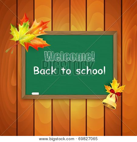Blackboard Decorated With Autumn Maple Leaves On Background A Wooden Wall