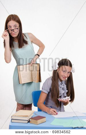Trainee Withdraws From A Cheat Sheet For The Exam