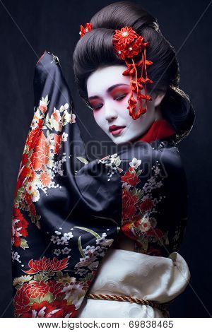 young pretty geisha in kimono