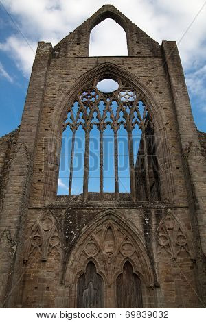 WALES, UK - 26 JULY 2014: Tintern abbey cathedral ruins. Abbey was established at 1131. Destroyed b