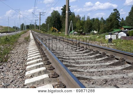 A Railway Under Blue Sky With Clouds Of White