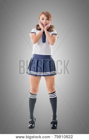 Japanese style school girl in sailor suit, full length portrait.