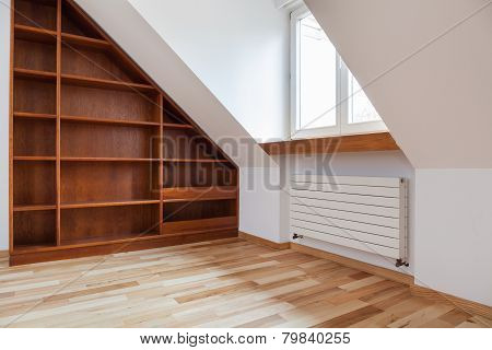 Empty Bookshelf In The Attic