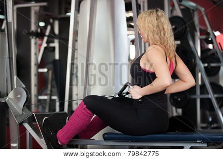 Girl Doing Exercises For Muscles Of Back On Training Apparatus