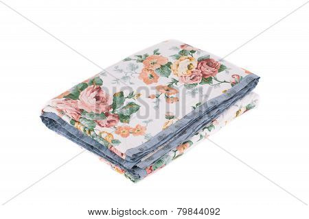 Stack of bedding set with flowers.