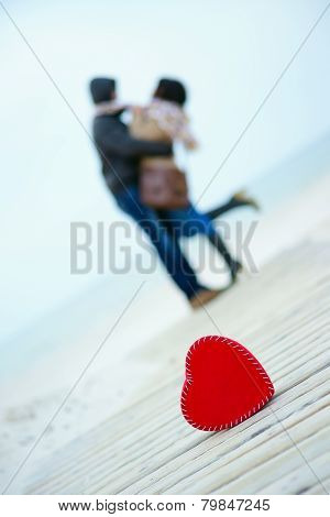 Heart on the road with man and woman on the background