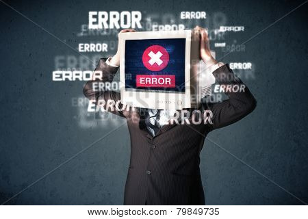Business man with pc monitor on his head and error messages darker background